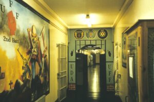 UDA wing, showing mural of avenging loyalist and other emblems